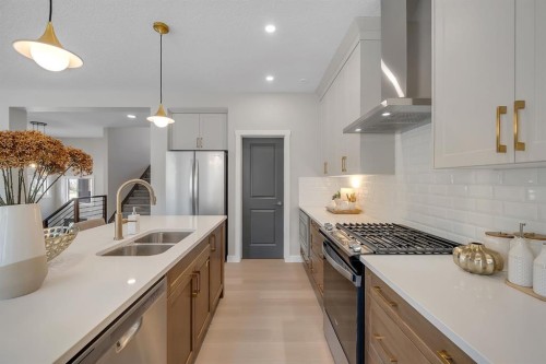 3 Tillotson Downs, Okotoks, AB - Indoor Photo Showing Kitchen With Stainless Steel Kitchen With Double Sink With Upgraded Kitchen