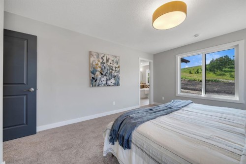 3 Tillotson Downs, Okotoks, AB - Indoor Photo Showing Bedroom