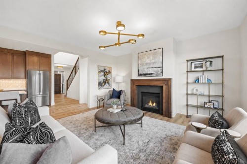 460 Discovery Place Sw, Calgary, AB - Indoor Photo Showing Living Room With Fireplace