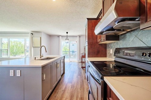 153 Royal Birch Bay Nw, Calgary, AB - Indoor Photo Showing Kitchen With Double Sink