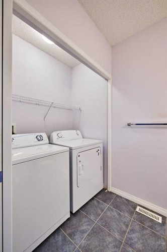 153 Royal Birch Bay Nw, Calgary, AB - Indoor Photo Showing Laundry Room