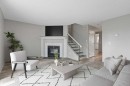 141-7172 Coach Hill Road Sw, Calgary, AB  - Indoor Photo Showing Living Room With Fireplace 