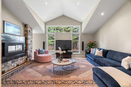10819 Willowfern Drive Se, Calgary, AB - Indoor Photo Showing Living Room With Fireplace