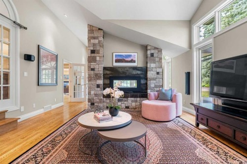 10819 Willowfern Drive Se, Calgary, AB - Indoor Photo Showing Living Room With Fireplace