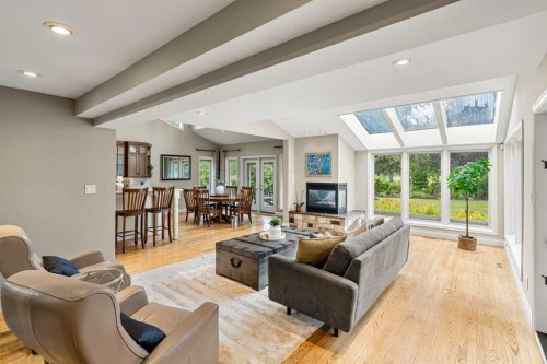 10819 Willowfern Drive Se, Calgary, AB - Indoor Photo Showing Living Room With Fireplace