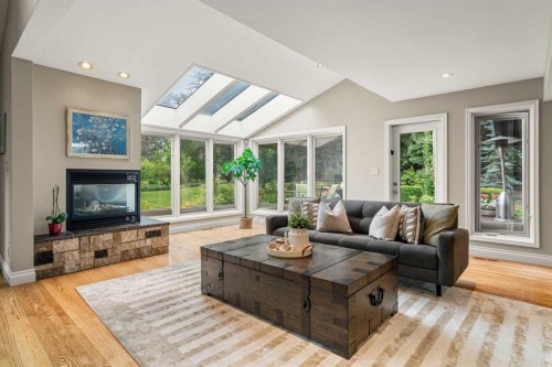 10819 Willowfern Drive Se, Calgary, AB - Indoor Photo Showing Living Room With Fireplace
