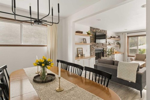 4331 Elgin Avenue Se, Calgary, AB - Indoor Photo Showing Dining Room With Fireplace