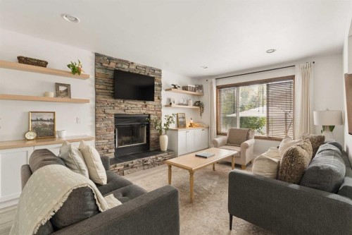 4331 Elgin Avenue Se, Calgary, AB - Indoor Photo Showing Living Room With Fireplace