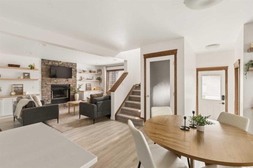 4331 Elgin Avenue Se, Calgary, AB - Indoor Photo Showing Dining Room With Fireplace