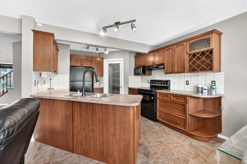 163 Valley Crest Close Nw, Calgary, AB - Indoor Photo Showing Kitchen With Double Sink