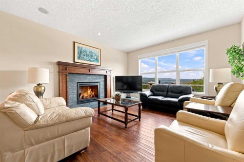 14 Ridge View Place, Cochrane, AB - Indoor Photo Showing Living Room With Fireplace