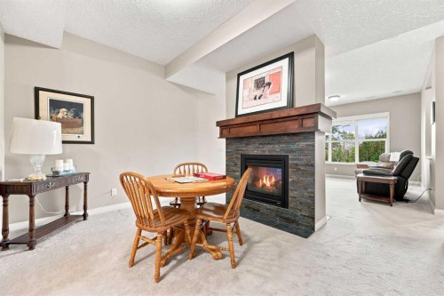 14 Ridge View Place, Cochrane, AB - Indoor With Fireplace
