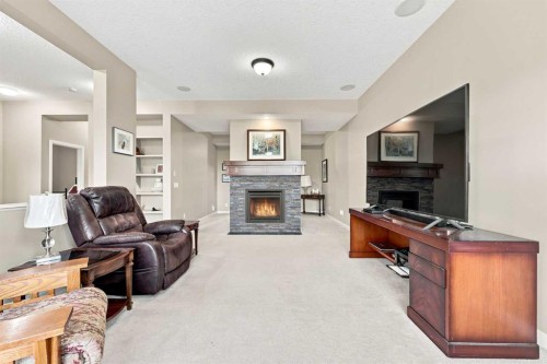 14 Ridge View Place, Cochrane, AB - Indoor Photo Showing Living Room With Fireplace