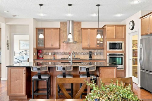 14 Ridge View Place, Cochrane, AB - Indoor Photo Showing Kitchen With Stainless Steel Kitchen With Upgraded Kitchen