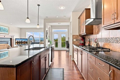 14 Ridge View Place, Cochrane, AB - Indoor Photo Showing Kitchen With Stainless Steel Kitchen With Double Sink With Upgraded Kitchen