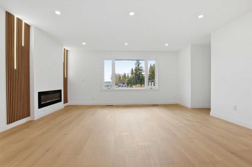 5439 Dalrymple Crescent Nw, Calgary, AB - Indoor Photo Showing Living Room With Fireplace