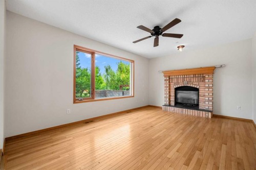115 Macewan Park Circle, Calgary, AB - Indoor Photo Showing Living Room With Fireplace