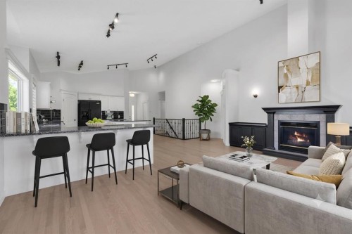 694 Panorama Hills Drive Nw, Calgary, AB - Indoor Photo Showing Living Room With Fireplace