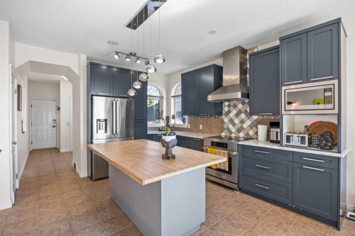 216 Tuscany Ridge View Nw, Calgary, AB - Indoor Photo Showing Kitchen With Stainless Steel Kitchen With Upgraded Kitchen