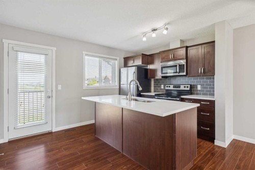 409 Copperpond Landing Se, Calgary, AB - Indoor Photo Showing Kitchen With Double Sink
