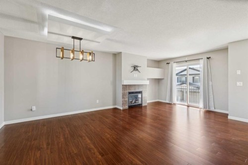 409 Copperpond Landing Se, Calgary, AB - Indoor Photo Showing Living Room With Fireplace