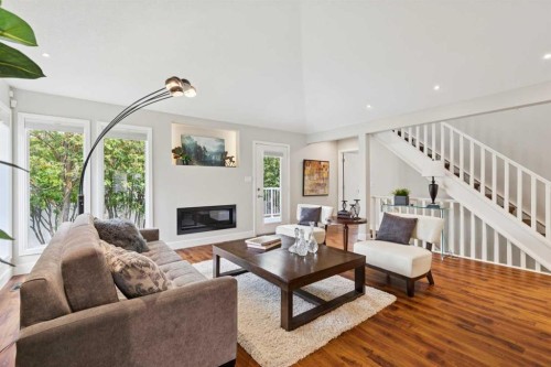 58 Candle Terrace Sw, Calgary, AB - Indoor Photo Showing Living Room With Fireplace