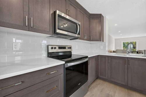 709-474 Seton Circle Se, Calgary, AB - Indoor Photo Showing Kitchen With Upgraded Kitchen