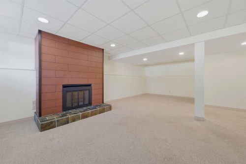 248 Parkland Crescent Se, Calgary, AB - Indoor Photo Showing Other Room With Fireplace