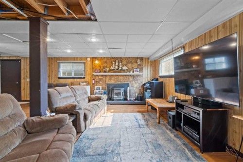 113 Spring Haven Court Se, Airdrie, AB - Indoor Photo Showing Living Room With Fireplace