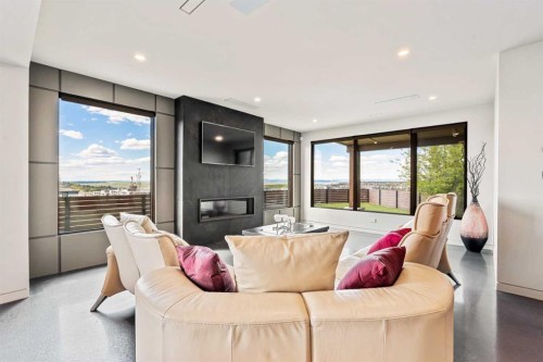 315 Aspen Ridge Place Sw, Calgary, AB - Indoor Photo Showing Living Room With Fireplace