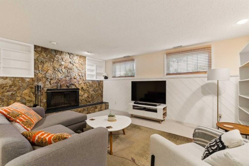 1824 Lake Bonavista Drive Se, Calgary, AB - Indoor Photo Showing Living Room With Fireplace