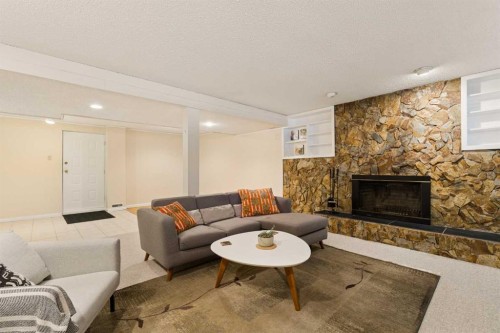 1824 Lake Bonavista Drive Se, Calgary, AB - Indoor Photo Showing Living Room With Fireplace