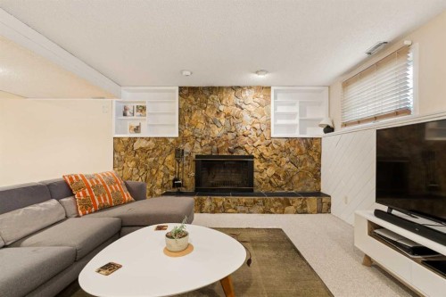 1824 Lake Bonavista Drive Se, Calgary, AB - Indoor Photo Showing Living Room With Fireplace