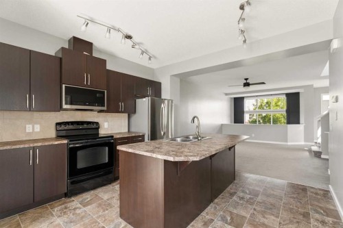1037 New Brighton Park Se, Calgary, AB - Indoor Photo Showing Kitchen With Double Sink With Upgraded Kitchen