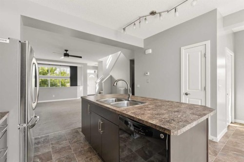 1037 New Brighton Park Se, Calgary, AB - Indoor Photo Showing Kitchen With Double Sink