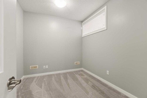 1037 New Brighton Park Se, Calgary, AB - Indoor Photo Showing Other Room