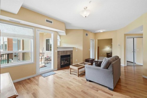 2144-48 Inverness Gate Se, Calgary, AB - Indoor Photo Showing Living Room With Fireplace