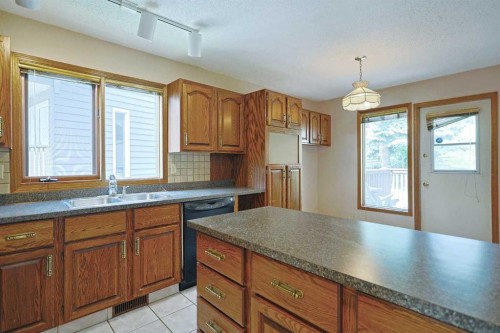 52 Edgeland Road Nw, Calgary, AB - Indoor Photo Showing Kitchen With Double Sink
