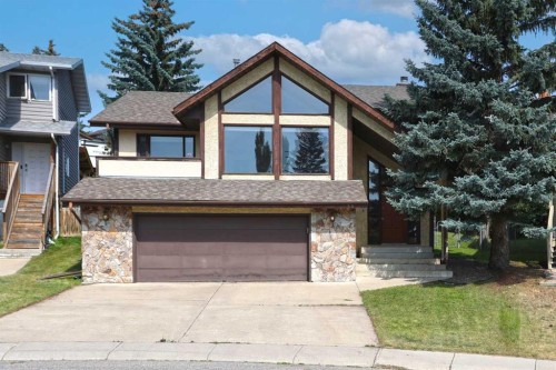 52 Edgeland Road Nw, Calgary, AB - Outdoor With Facade