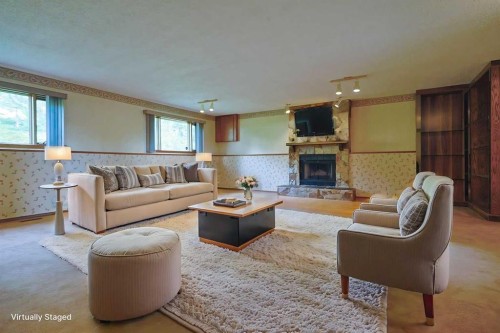 52 Edgeland Road Nw, Calgary, AB - Indoor Photo Showing Living Room With Fireplace