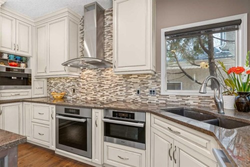58 Mt Gibraltar Place Se, Calgary, AB - Indoor Photo Showing Kitchen With Stainless Steel Kitchen With Double Sink With Upgraded Kitchen
