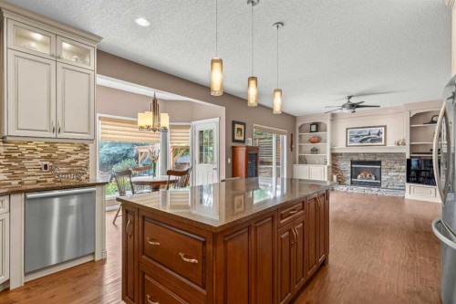58 Mt Gibraltar Place Se, Calgary, AB - Indoor Photo Showing Kitchen With Fireplace With Upgraded Kitchen