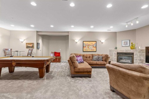 58 Mt Gibraltar Place Se, Calgary, AB - Indoor Photo Showing Other Room With Fireplace