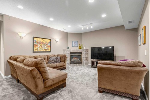 58 Mt Gibraltar Place Se, Calgary, AB - Indoor Photo Showing Other Room With Fireplace