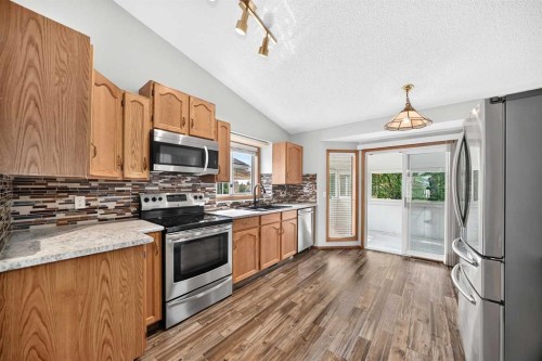 108 Woodside Close Nw, Airdrie, AB - Indoor Photo Showing Kitchen With Double Sink