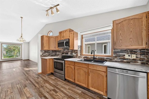 108 Woodside Close Nw, Airdrie, AB - Indoor Photo Showing Kitchen With Double Sink