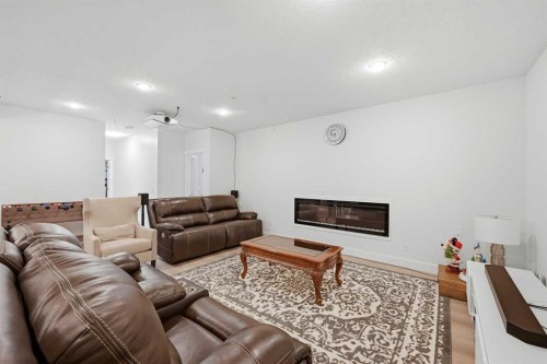 160 Panatella Crescent Nw, Calgary, AB - Indoor Photo Showing Living Room With Fireplace