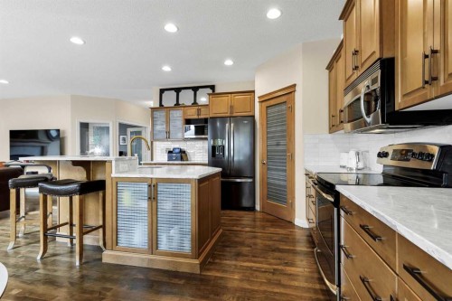 1437 Kings Heights Boulevard Se, Airdrie, AB - Indoor Photo Showing Kitchen With Stainless Steel Kitchen With Upgraded Kitchen