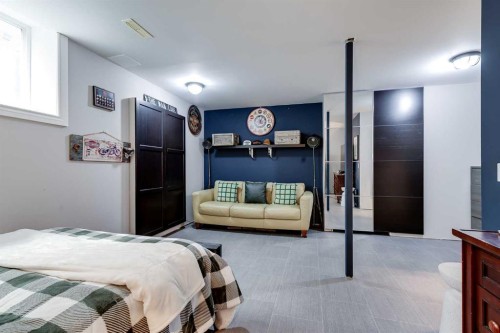 1437 Kings Heights Boulevard Se, Airdrie, AB - Indoor Photo Showing Bedroom