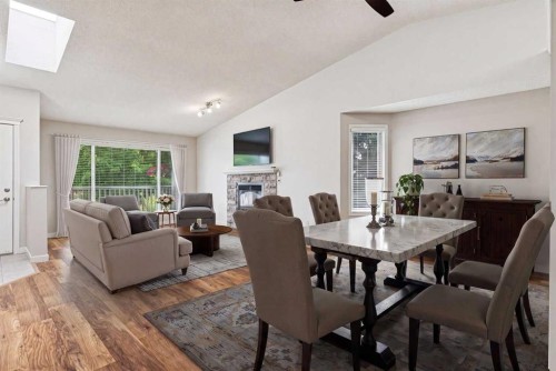 159 Woodbend Way, Okotoks, AB - Indoor With Fireplace